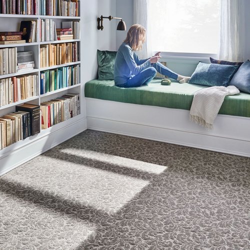 Child reading on bed - Nantahala Flooring Outlet | Franklin